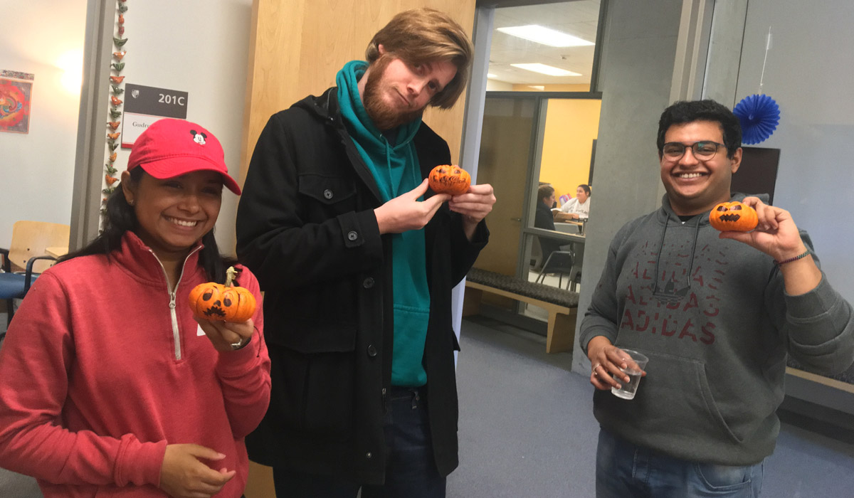 International students with Halloween pumpkins